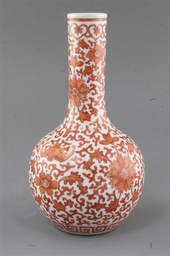 A Chinese iron red painted bottle vase, Qianlong mark but late 19th/early 20th century, height 25.8cm